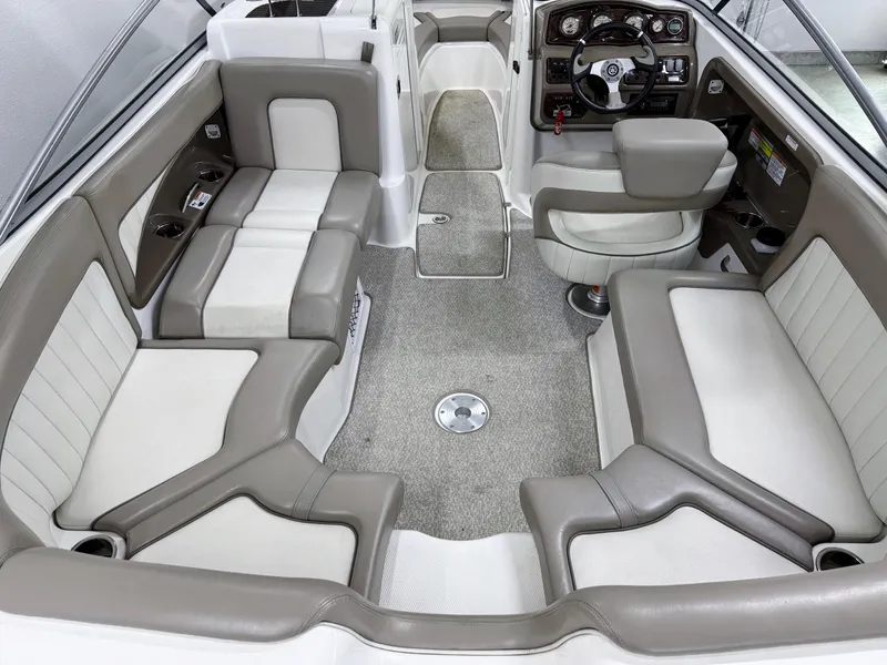 Slide: The Image of 2009 Yamaha Boats 232 Limited S interior with spacious seating and modern dashboard. - 6