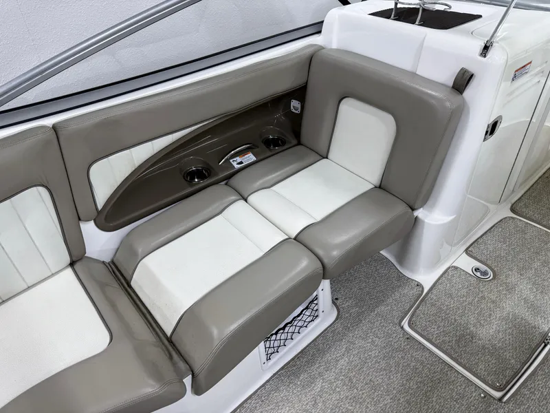 Slide: The Image of 2009 Yamaha Boats 232 Limited S interior seating with beige and white upholstery. - 7