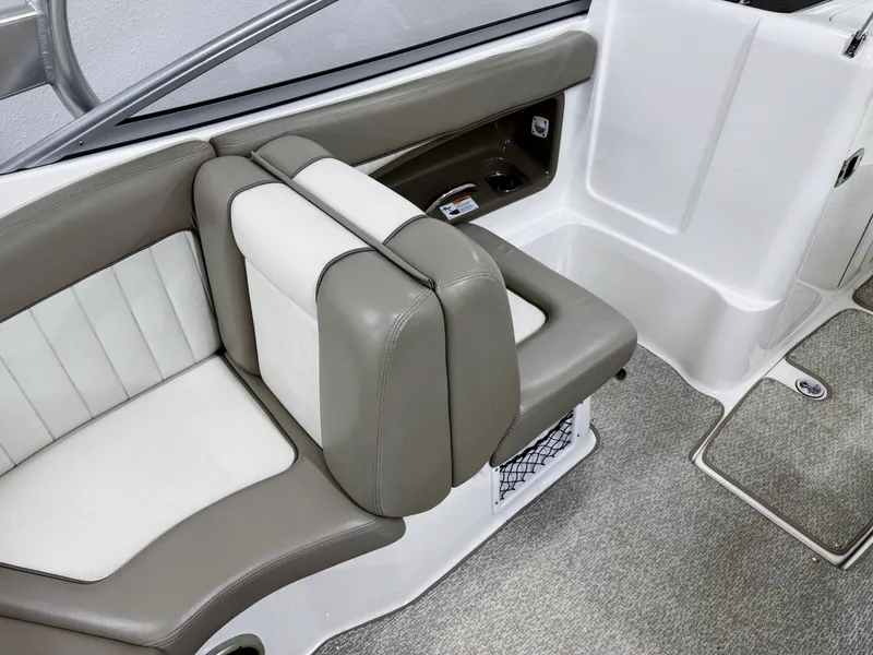 Slide: The Image of 2009 Yamaha Boats 232 Limited S interior seating with gray and white upholstery. - 8