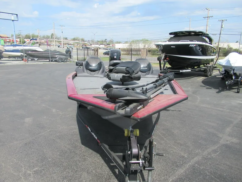 Slide: The Image of 2021 Bass Tracker PT195 TXW boat parked in a lot, front view. - 4