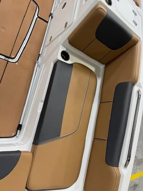 Slide: The Image of 2024 Tahoe 1950 boat interior with tan and black seating. - 5
