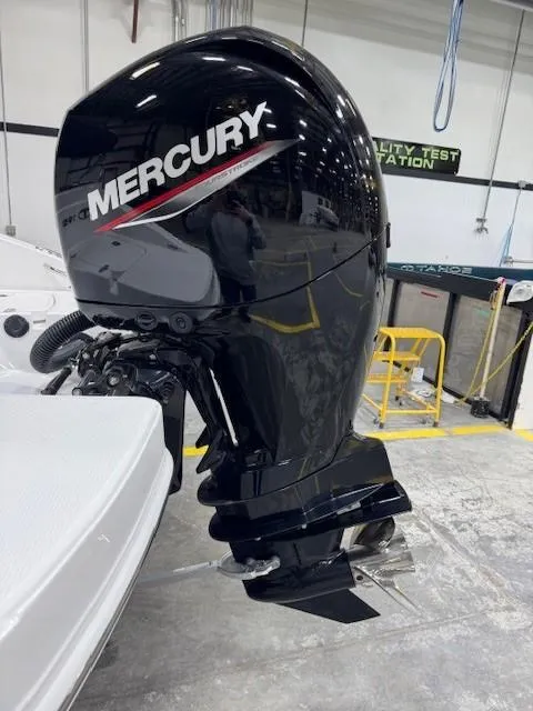 Slide: The Image of Mercury outboard motor on 2024 Tahoe 1950 boat in a testing facility. - 7