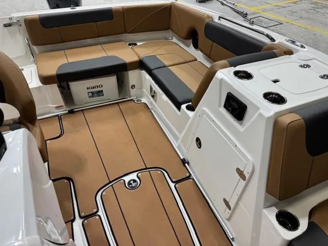 Slide: The Image of Interior of 2024 Tahoe 1950 boat with tan and black seating. - 8