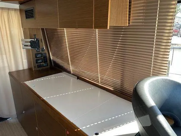 Slide: The Image of Interior of 2023 Bavaria R40 Coupe with wooden cabinetry and modern design. - 16