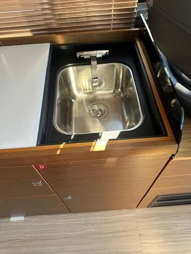 Slide: The Image of 2023 Bavaria R40 Coupe kitchen sink with modern faucet and wooden cabinetry. - 28