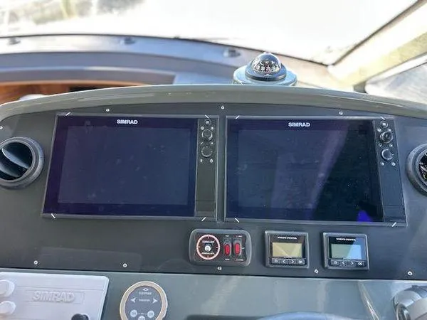 Slide: The Image of Control panel of 2023 Bavaria R40 Coupe with dual Simrad displays. - 42