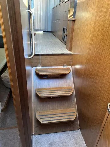 Slide: The Image of Interior stairs of 2023 Bavaria R40 Coupe yacht with wooden finish. - 48