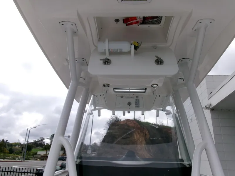 Slide: The Image of 2020 Sea Fox 248 Commander boat console with overhead storage and equipment. - 15