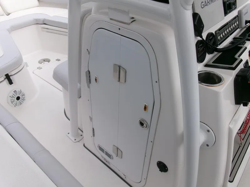 Slide: The Image of 2020 Sea Fox 248 Commander boat interior with storage compartment and control panel. - 16