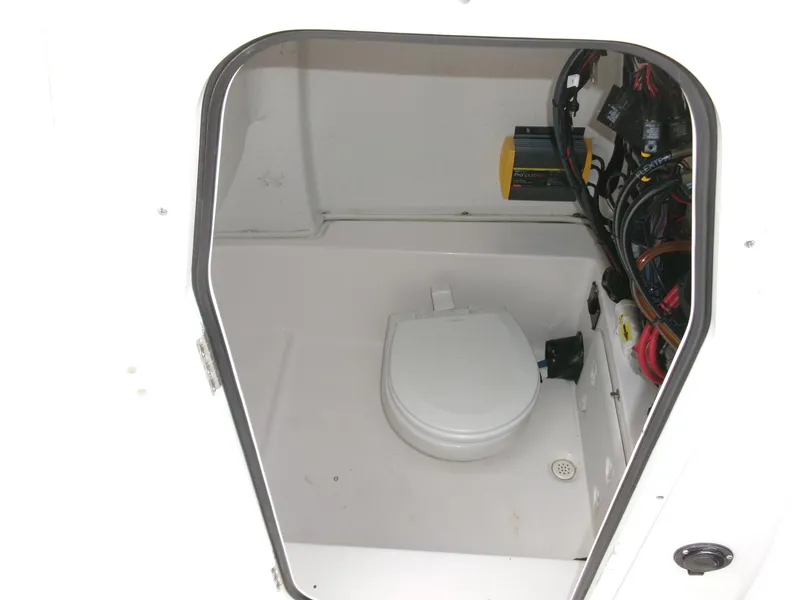 Slide: The Image of 2020 Sea Fox 248 Commander boat interior with compact marine toilet and wiring. - 17