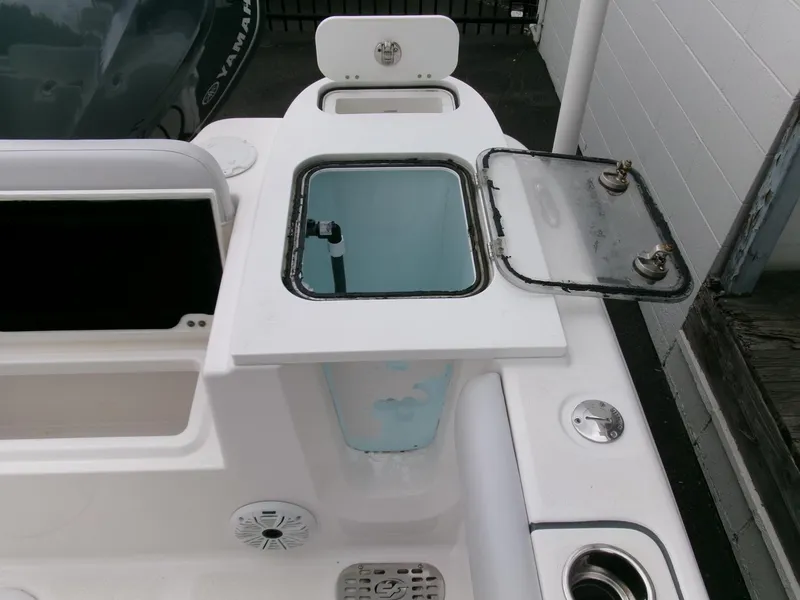 Slide: The Image of 2020 Sea Fox 248 Commander boat with open storage compartments and fishing features. - 28