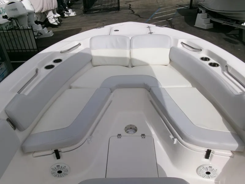 Slide: The Image of 2020 Sea Fox 248 Commander boat interior with white cushioned seating and cup holders. - 6