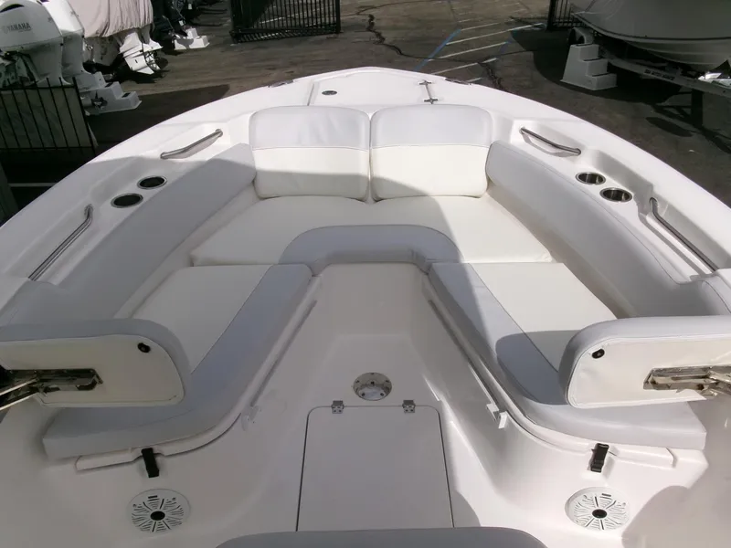 Slide: The Image of 2020 Sea Fox 248 Commander boat interior with white cushioned seating and cup holders. - 7