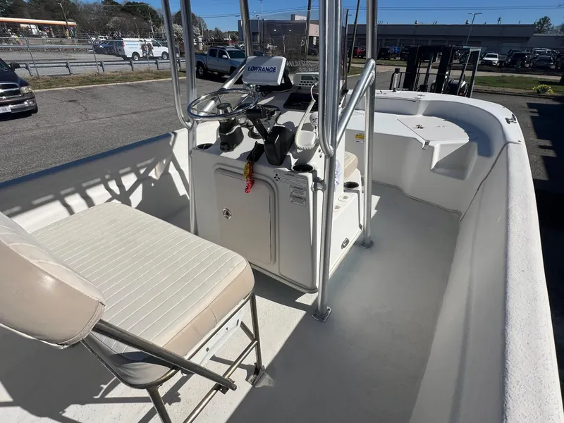 Slide: The Image of 2016 Carolina Skiff 198 DLV boat interior with steering console and seating. - 12