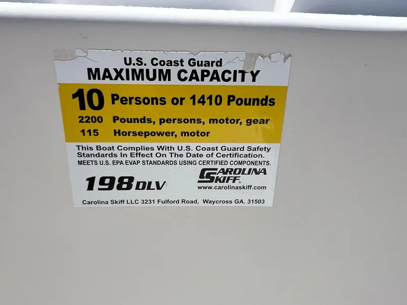 Slide: The Image of 2016 Carolina Skiff 198 DLV capacity label: 10 persons or 1410 pounds, 115 horsepower. - 18