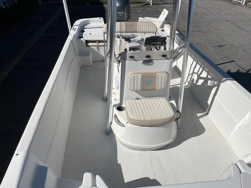 Slide: The Image of 2016 Carolina Skiff 198 DLV boat interior with seating and console. - 20