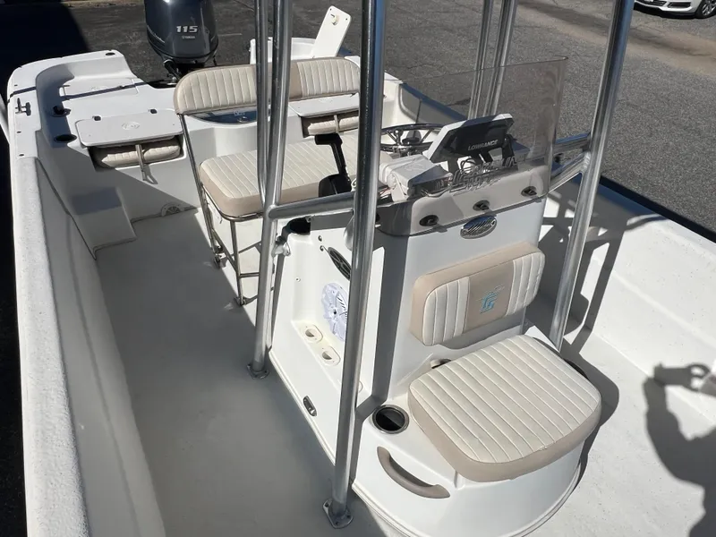 Slide: The Image of 2016 Carolina Skiff 198 DLV boat interior with seating and console. - 21