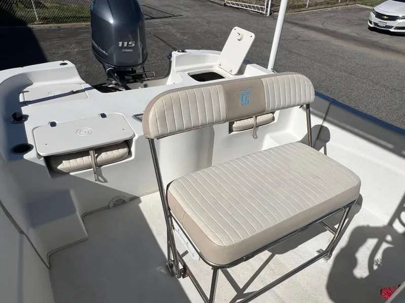 Slide: The Image of 2016 Carolina Skiff 198 DLV boat interior with seating and Yamaha 115 engine. - 22
