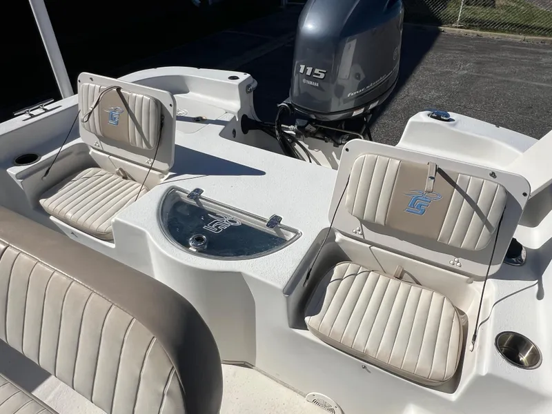 Slide: The Image of 2016 Carolina Skiff 198 DLV boat interior with seating and Yamaha 115 engine. - 24
