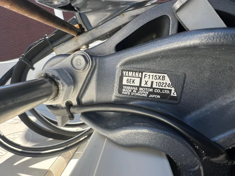 Slide: The Image of Close-up of a Yamaha F115XB motor on a 2016 Carolina Skiff 198 DLV boat. - 29