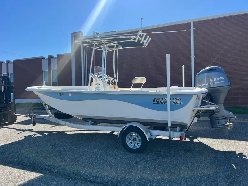 Slide: The Image of 2016 Carolina Skiff 198 DLV boat with Yamaha outboard motor on trailer. - 3