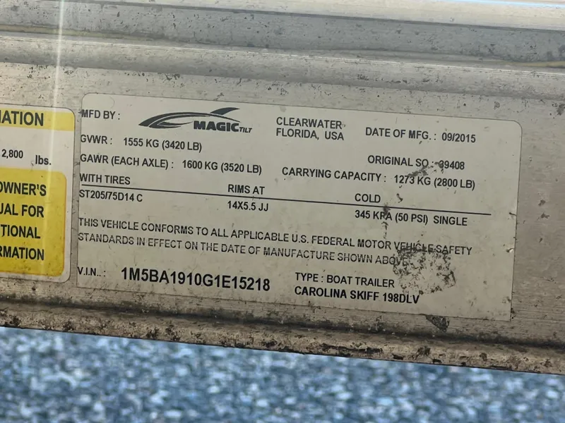 Slide: The Image of Label on a 2016 Carolina Skiff 198 DLV boat trailer, detailing specifications and compliance information. - 30