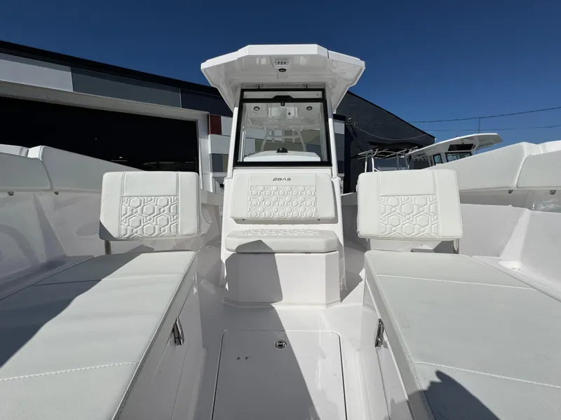 Slide: The Image of 2025 Aquasport 28AS Center Console boat with white seating and modern design. - 19