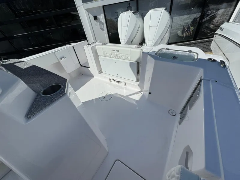 Slide: The Image of 2025 Aquasport 28AS Center Console boat interior with dual engines and seating area. - 7
