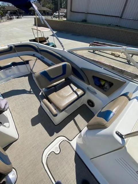 Slide: The Image of 2005 Bayliner 249 SD boat interior with seating and carpeted floor. - 6