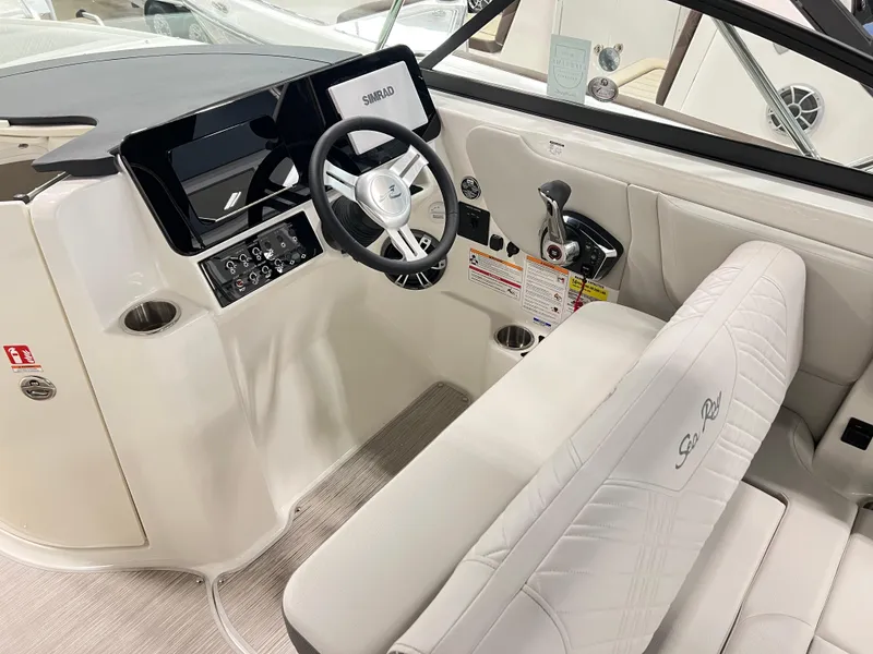Slide: The Image of 2025 Sea Ray SDX 250 boat interior with steering wheel and control panel. - 7