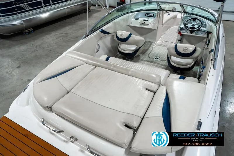 Slide: The Image of 2007 Starcraft Limited 1900 OB boat interior with white seating and steering console. - 14