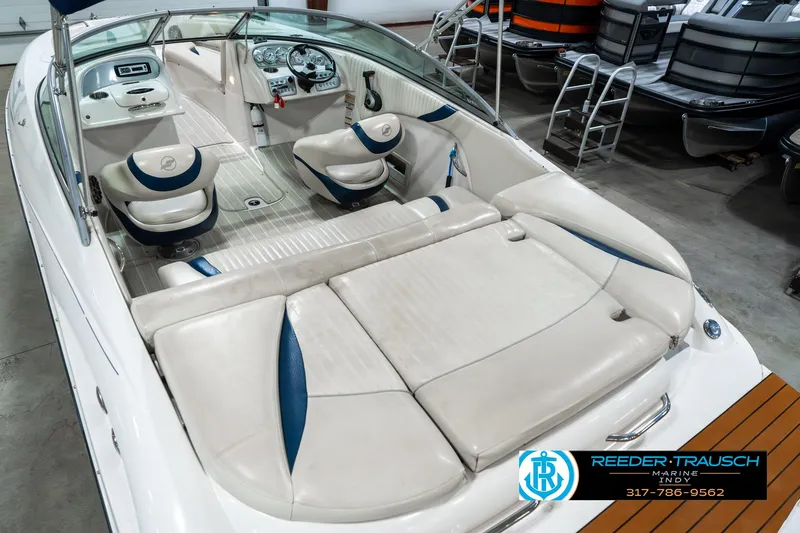 Slide: The Image of 2007 Starcraft Limited 1900 OB boat interior with white and blue seating, dashboard, and steering wheel. - 15