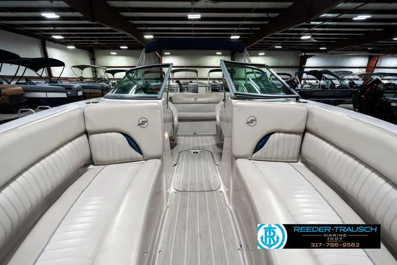 Slide: The Image of 2007 Starcraft Limited 1900 OB boat interior with beige seating in showroom. - 19