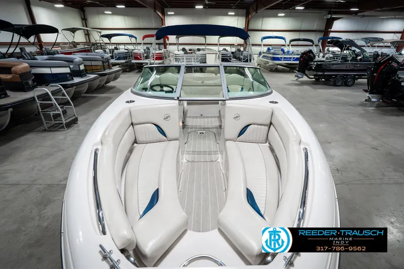 Slide: The Image of 2007 Starcraft Limited 1900 OB boat with white interior in showroom. - 22