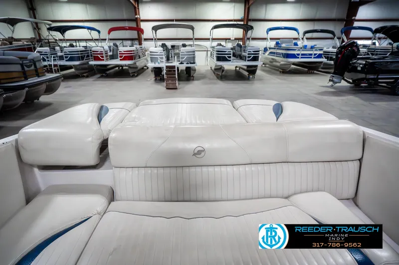 Slide: The Image of 2007 Starcraft Limited 1900 OB boat interior in showroom with multiple boats in background. - 28