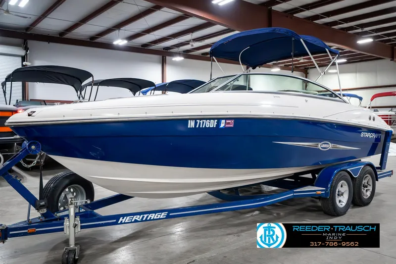 Slide: The Image of 2007 Starcraft Limited 1900 OB boat on a trailer in a showroom. - 3