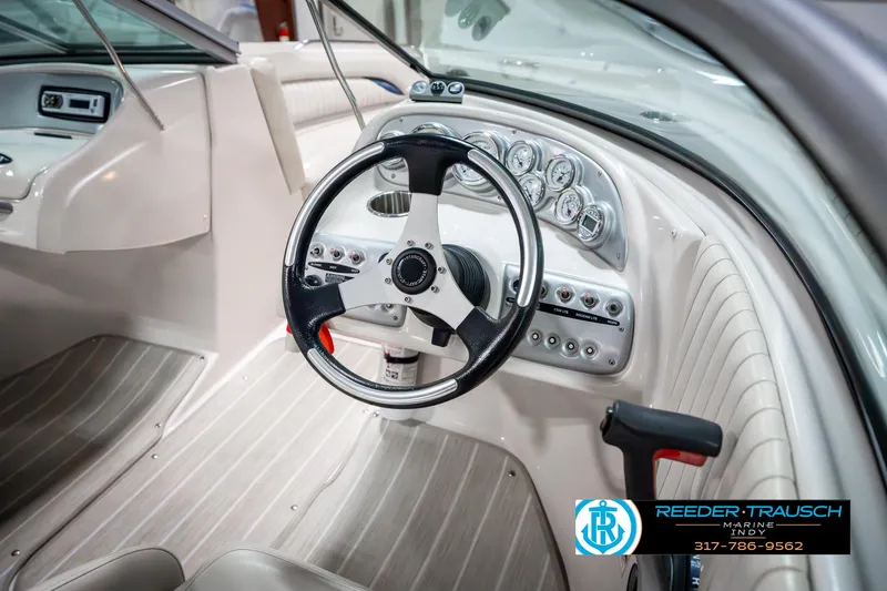 Slide: The Image of 2007 Starcraft Limited 1900 OB boat interior with steering wheel and dashboard controls. - 32