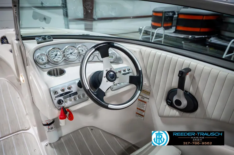 Slide: The Image of 2007 Starcraft Limited 1900 OB boat interior with steering wheel and dashboard controls. - 33