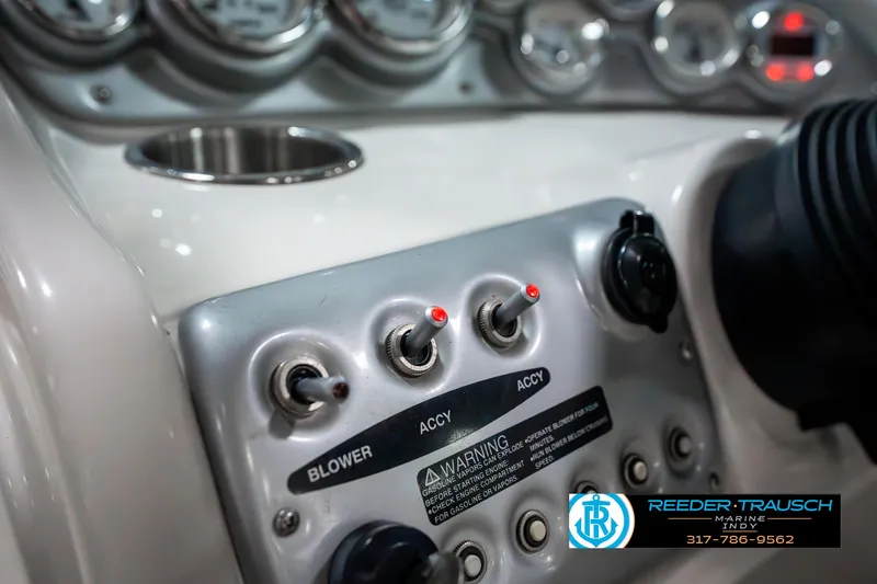 Slide: The Image of Control panel of a 2007 Starcraft Limited 1900 OB boat with switches and gauges. - 35