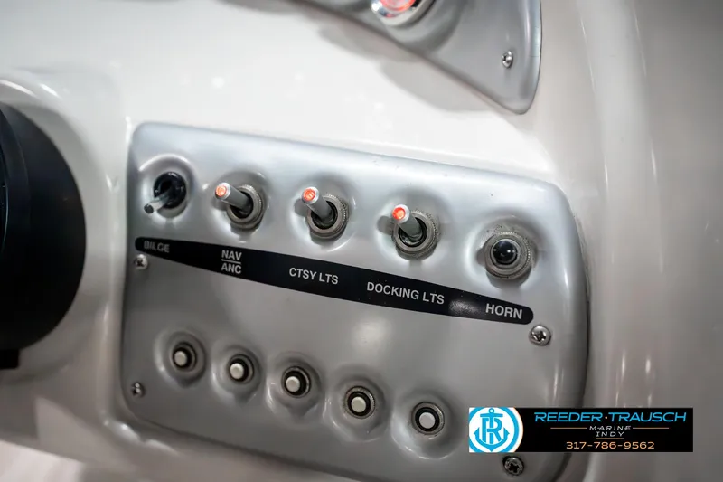 Slide: The Image of Control panel of a 2007 Starcraft Limited 1900 OB boat with labeled switches. - 38