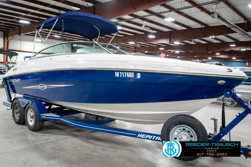 Slide: The Image of 2007 Starcraft Limited 1900 OB boat on trailer in indoor showroom. - 6