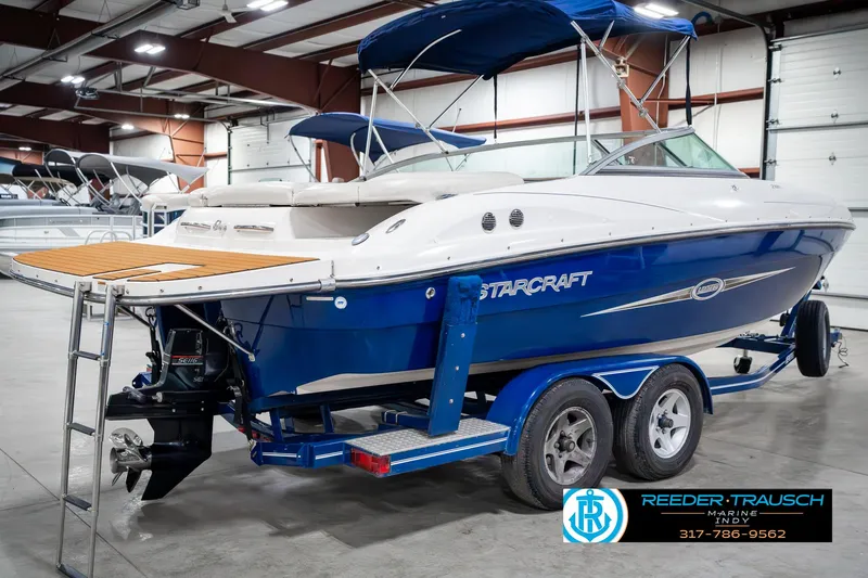 Slide: The Image of 2007 Starcraft Limited 1900 OB boat on trailer in indoor showroom. - 8