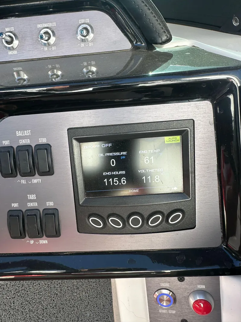 Slide: The Image of 2023 MasterCraft NXT22 dashboard with digital display and control panel. - 7