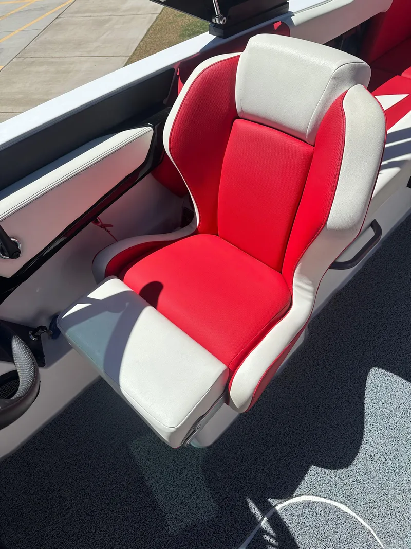 Slide: The Image of Red and white seat in 2023 MasterCraft NXT22 boat interior. - 9