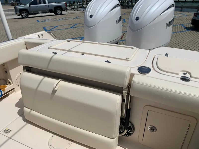 Slide: The Image of 2024 Grady-White 257 Fisherman boat with Yamaha engines, featuring a spacious deck and seating. - 13