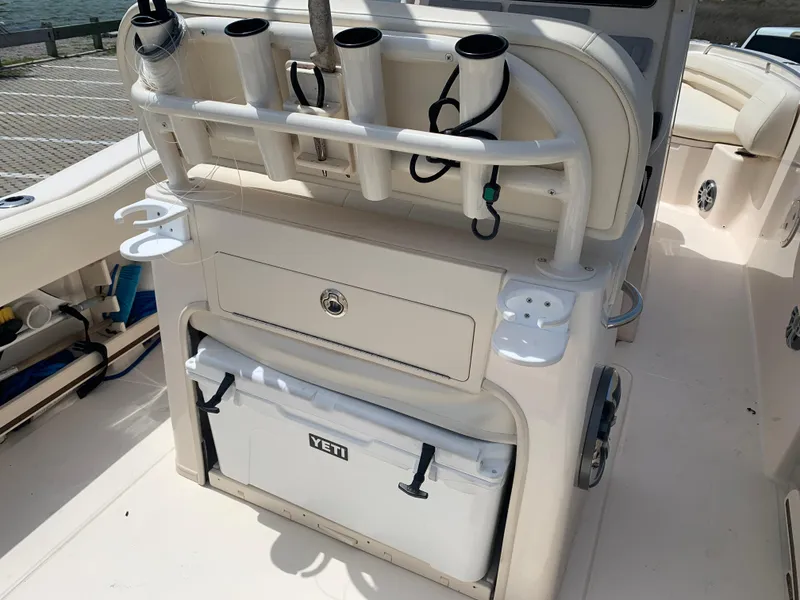 Slide: The Image of 2024 Grady-White 257 Fisherman boat with rod holders and Yeti cooler. - 14