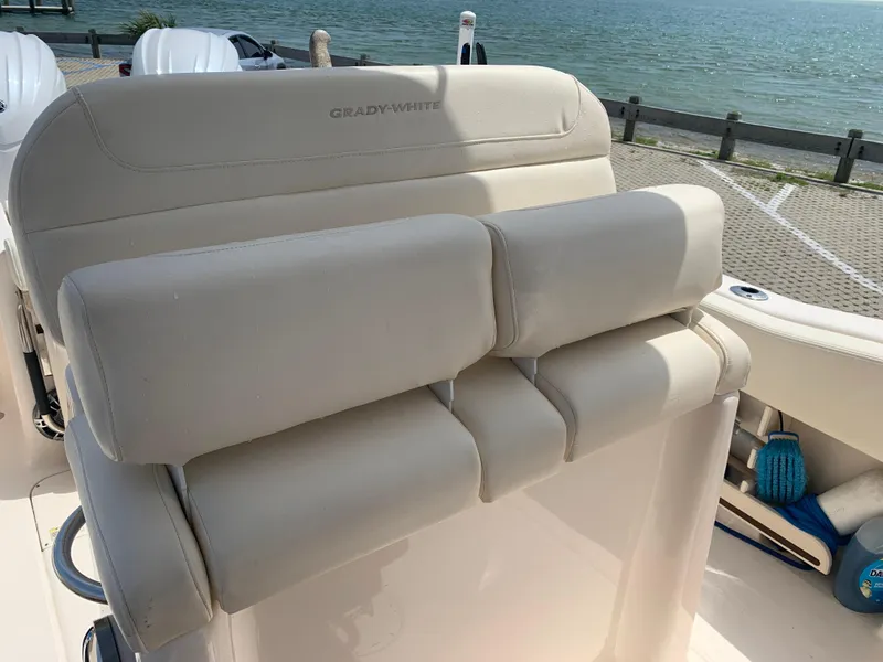 Slide: The Image of 2024 Grady-White 257 Fisherman boat seat with ocean view in background. - 16