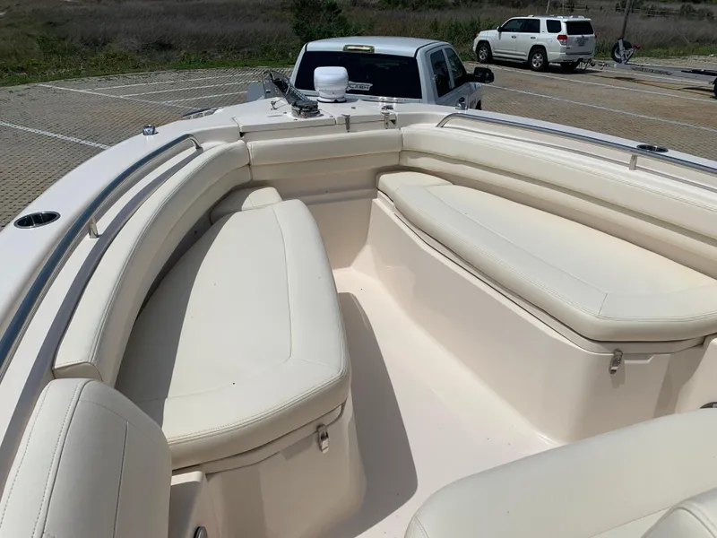 Slide: The Image of 2024 Grady-White 257 Fisherman boat with spacious seating in a parking lot. - 6