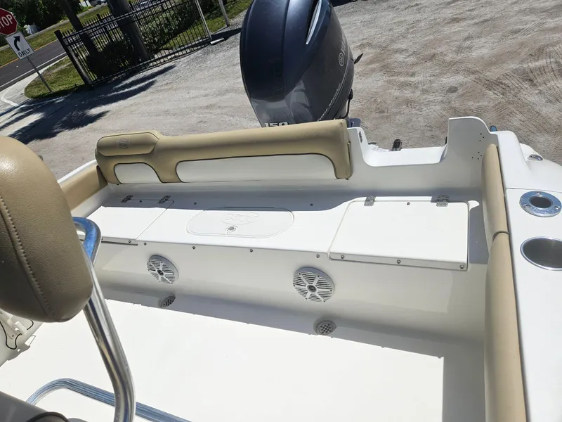 Slide: The Image of 2018 Key West 219 FS boat interior with seating and engine view. - 14