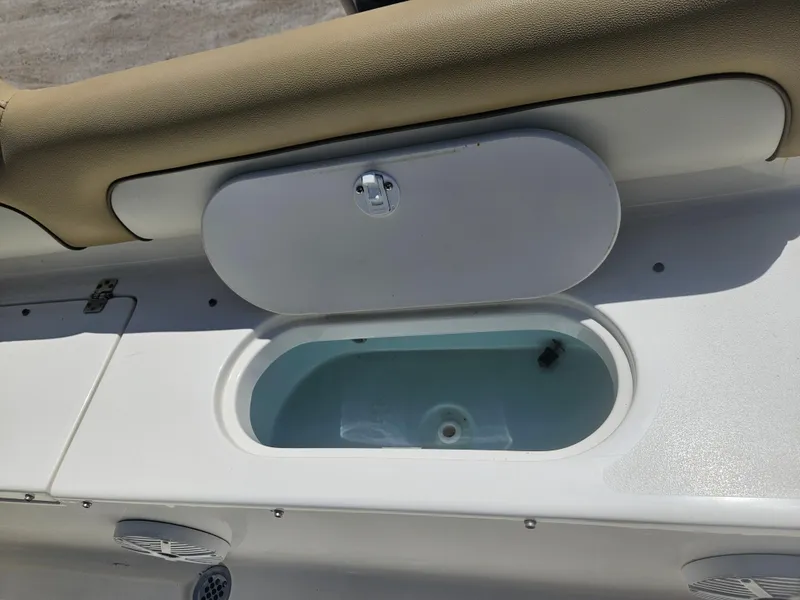 Slide: The Image of 2018 Key West 219 FS boat livewell with open lid, showcasing interior details. - 15